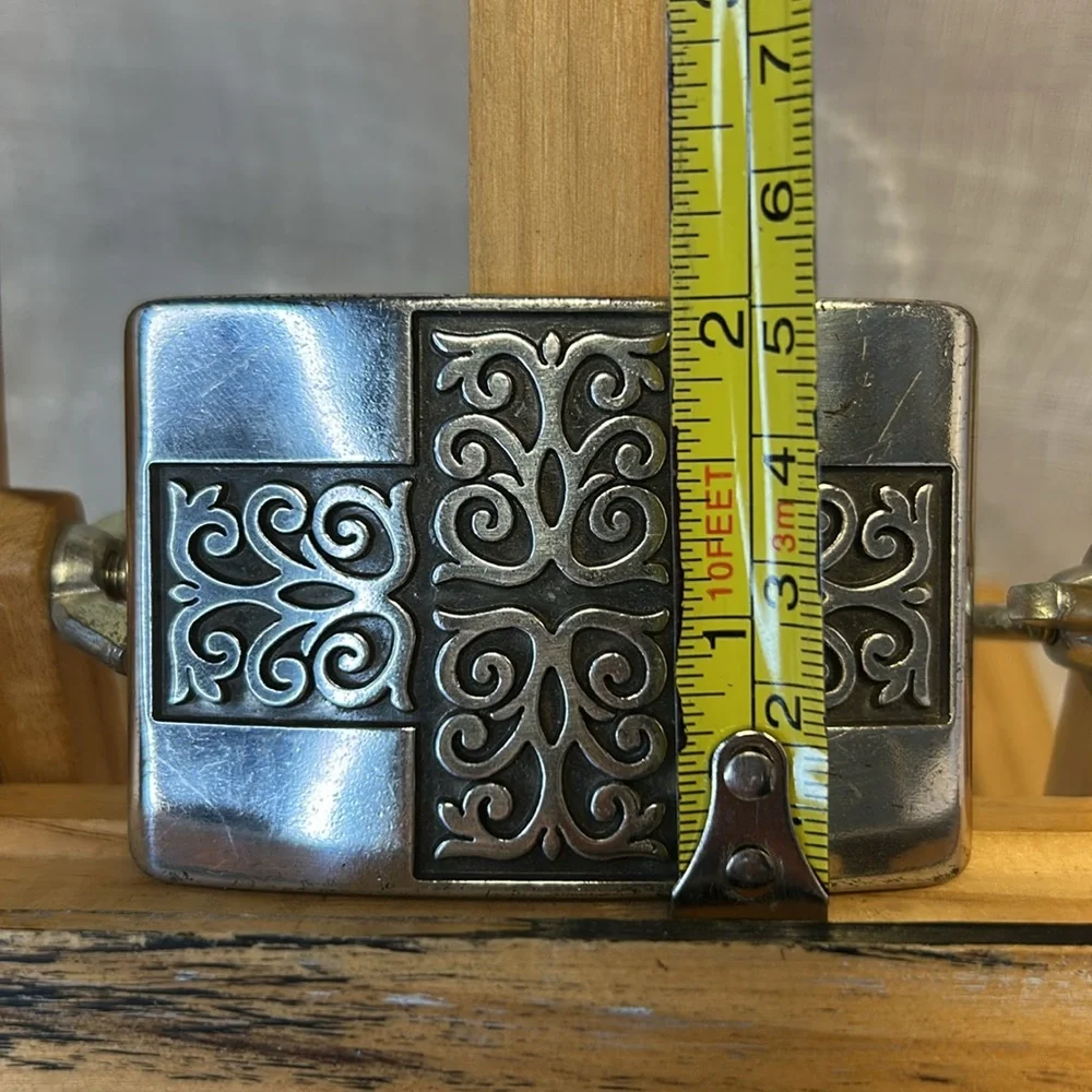 Celtic cross/decorative silver colored belt buckle made
